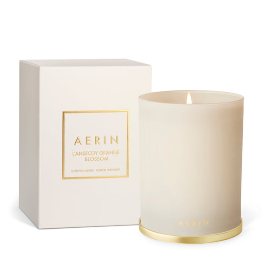 AERIN candle and packaging on a white background