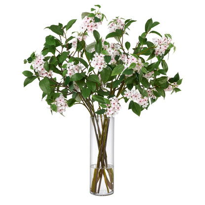 Blair Garden luxury artificial apple blossom arrangement with clusters of white blossoms with pink centers and green leaves by Diane James Home, displayed in a tall clear glass vase against a white background.
