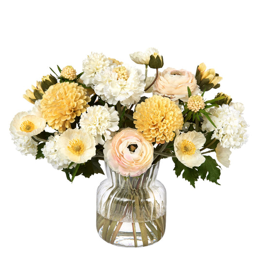 Bouquet of flowers by Diane James Home in a clear vase on a white background