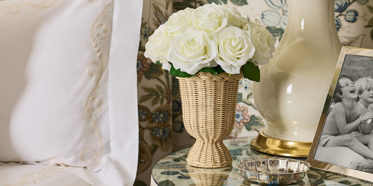 White Roses in Freya Rattan Pedestal Vase- Diane James Home | Faux Floral Couture Handmade In The USA