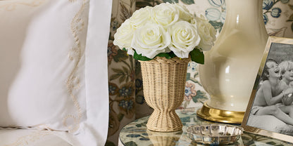 White Roses in Freya Rattan Pedestal Vase- Diane James Home | Faux Floral Couture Handmade In The USA