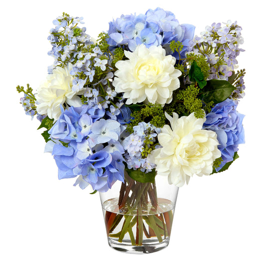 Bouquet of faux blue and white flowers in a clear vase by Diane James Home on a white background