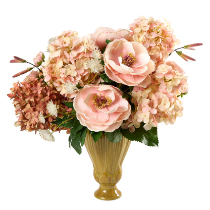 Highland Fling, a decorative luxury artificial flower arrangement by Diane James Home in a ribbed gold-colored ceramic vase, featuring large pale pink peonies, clusters of pink and cream hydrangeas, and green leaves, photographed on a plain white background.