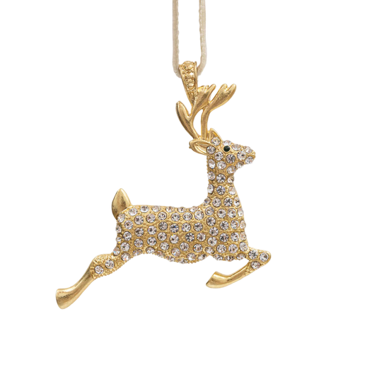 Gold deer-shaped holiday ornament with crystals on a white background