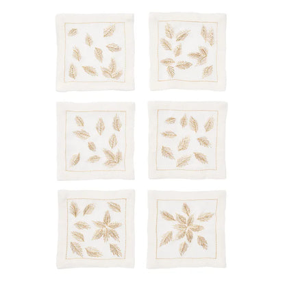 Six square whitelinen napkins arranged in a 3-by-2 grid on a white background. Eachnapkin features embroidered gold leaf motifs and a thingoldborder.