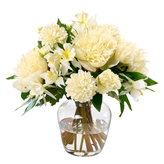 Bouquet of faux white flowers by Diane James Home in a clear vase on a white background