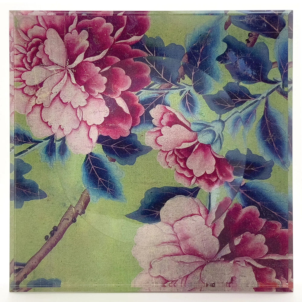 Acrylic trinket bowl with a floral design with pink flowers and green leaves on a green background