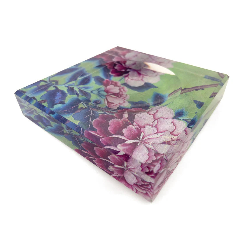 Floral-patterned acrylic trinket bowl on a white background