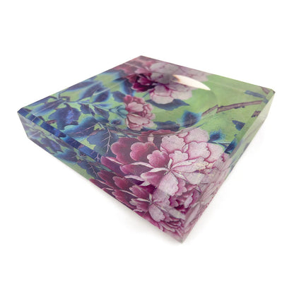 Floral-patterned acrylic trinket bowl on a white background