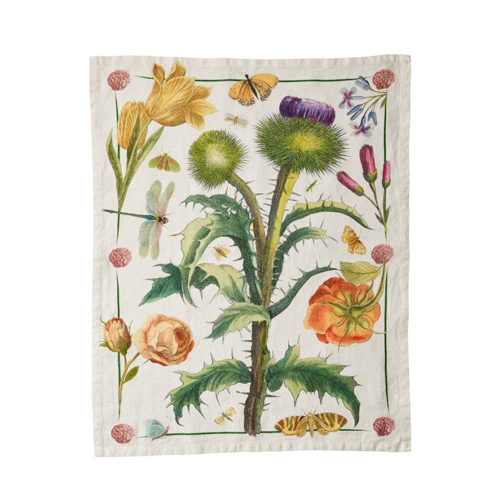 An off-white linen tea towel from Reprotique featuring a vintage botanical illustration of a thistle plant with yellow flowers, orange poppies, butterflies, and dragonflies.