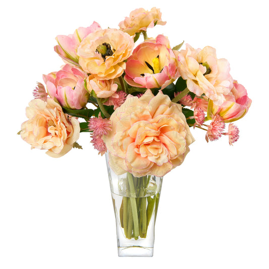 Bouquet of pink and peach flowers in a clear glass vase by Diane James Home on a white background